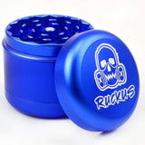 Blue metal herb grinder with skull and gas mask logo in Ruckus Black 4-Piece design