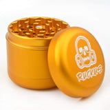 Gold metal herb grinder with skull logo for Ruckus Black 4-Piece and Custom Ruckus Box